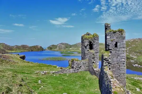 Three Castles Head - old castle ruins linking a lake and the cliffs at the most southern point of Ireland