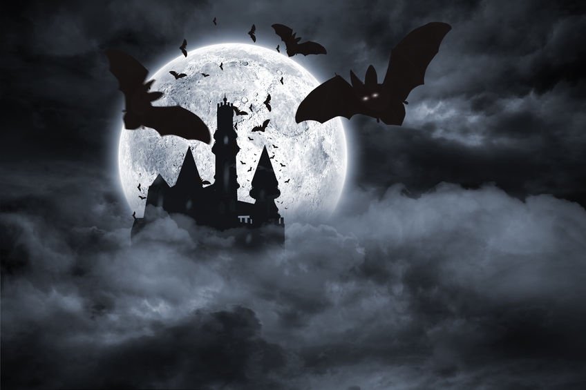 46688793 - digitally generated bats flying from draculas castle