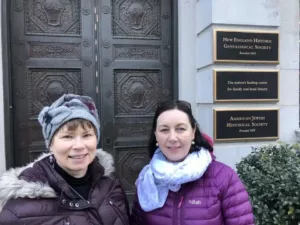 American genealogist Pam Holland and Carina standing in front of the New England Historic Genealogical society doors