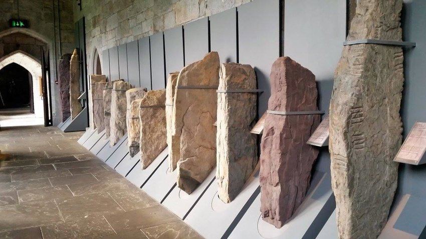 Ogham Stones: Run Your Hand Across a Piece of History 2 A display of multiple ogham stones in a line
